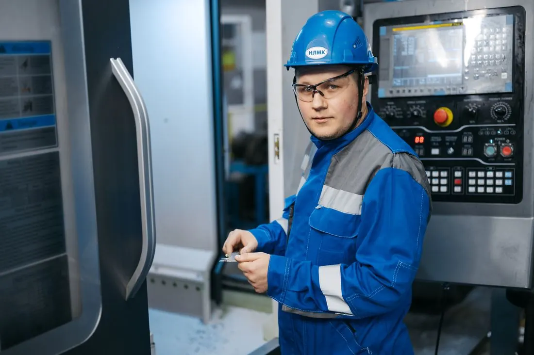 Engineer operating a CNC machine