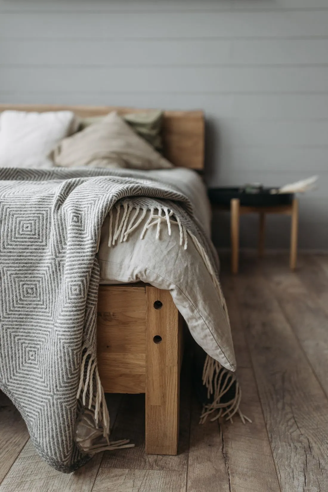 A cozy bedroom with soft blankets and pillows